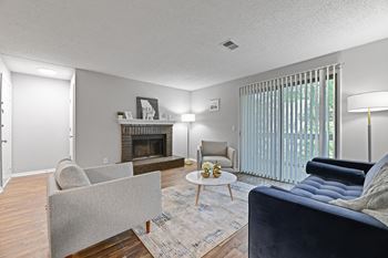 A living room with a fireplace and couches